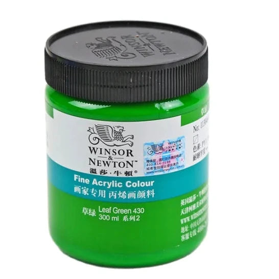 Green jar of Winsor Newton acrylic paint with black lid on a white background